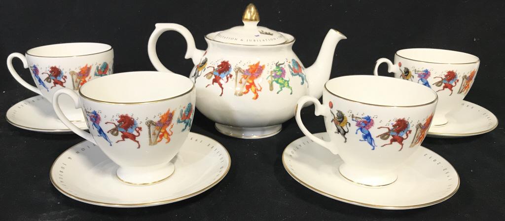 Lot 9 DIAMOND JUBILEE FORTNUM & MASON Tea Set: Lot includes 1 teapot, 4 teacups & 4 saucers. Undersides Of each are marked FORTNUM & MASON. Each has detail depicting various animals playing instruments. Teapot measures approximately 8 inches long 