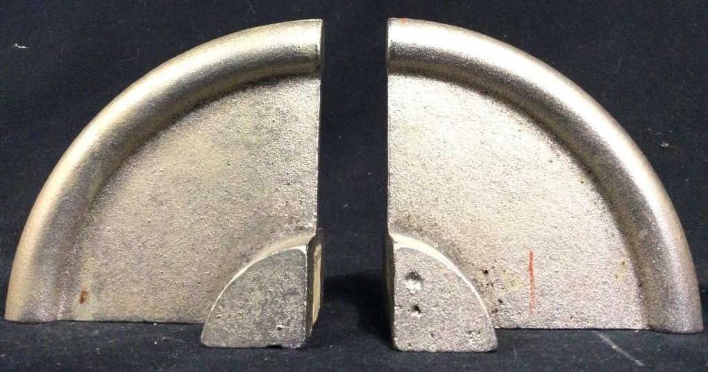 Pair GEORG JENSEN Silver Toned Metal Bookends: Tag reads GEORG JENSEN. Bookends are silver toned and metal. Each piece is a quarter circle. Piece measures approx 4 inches tall 3 inches wide. Metal Bookends, pair Bookends, pair of Bookends. art dec