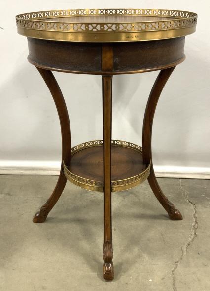 Theodore Alexander Tiered Occasional Table: Theodore Alexander Two Tiered Occasional Table With Pierced brass gallery bordering both top and lower shelf, supported by carved hoof footed splayed legs, measures approx 27 inches tall x 18.5 inches