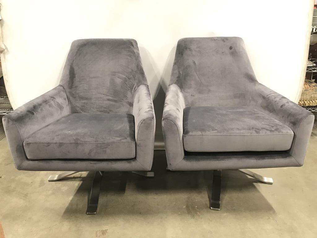 Grey Toned Faux Suede Swivel Chairs ALL MODERN: Swivel chairs are grey toned. Each have silver toned bases. Chairs were originally purchased from ALL MODERN. Pieces have Velcro underneath cushions. Chairs measure approx 34 inches tall 30 inches wid