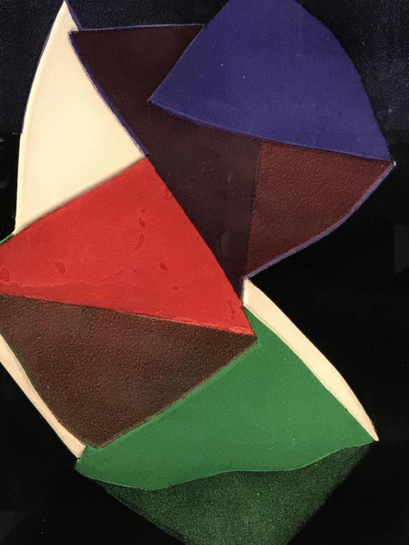 Signed & Numbered Abstract Color Intaglio Print: Signed illegibly in pencil in lower right corner, numbered 99/100 in lower left corner. Plate marks visible. Intaglio print in tones of red, green, purple, and black. Print is matted and set behind gl