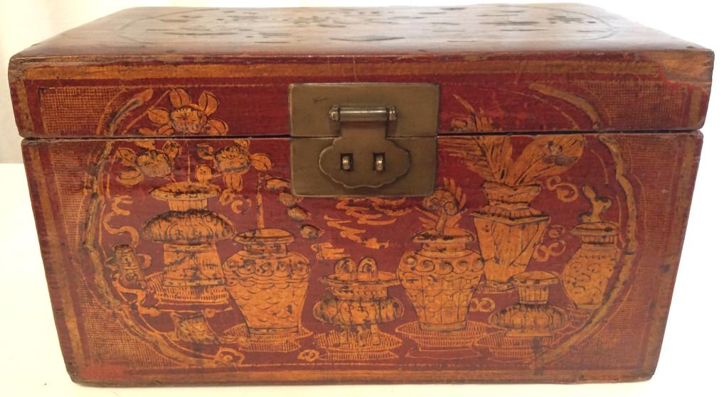 ABC CARPET & HOME Hand Painted Asian Box: Tag on backside reads ABC. Keepsake box is hand painted. Piece is red toned with gold toned floral leaf & vase detail. Piece measures approx 13 inches long 7.5 inches tall and deep. keepsake box, dres