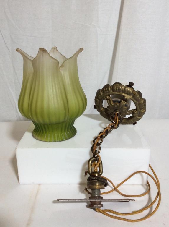 Vintage Floral Hanging Lamp: Vintage floral hanging lamp. Lampshade resembles a flower, and is made of frosted glass. The shade measures approx. 5.5 inches H, and has a diameter of 4.5 inches at its widest. The chain measure appr