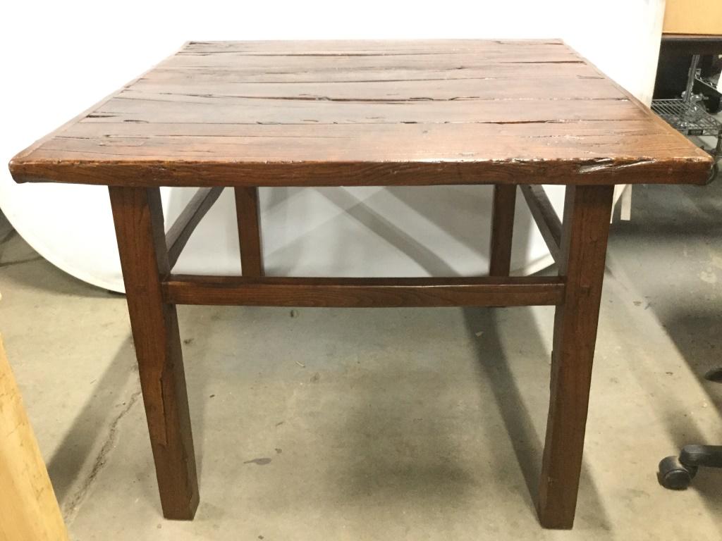 Antique Handmade Wooden Table: Table has handmade elements. Piece is chocolate toned. Piece has high stretchers. Table measures approximately 30 inches tall 36 inches deep 38 inches wide. Handmade table, antique table, vintage tabl