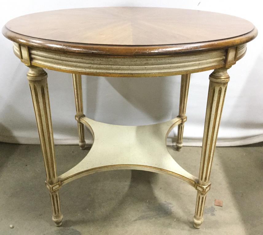 JOHN WIDDICOMB Carved Wooden Side Table: Underside of piece is marked JOHN WIDDICOMB CO GRAND RAPIDS. Side table is round. Contains beige toned wooden top. Piece has 4 carved wooden legs with tones of cream and gold. Table has stretcher near