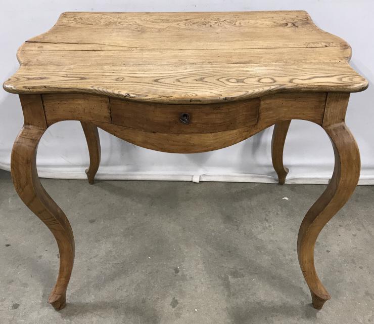 Antique French Provincial Style Writing Desk: Antique French Provincial Style Writing Desk in light toned wood, single dovetailed drawer with brass and bronze toned metal lock with key, and cabriole legs, some cracks to wood at top and surface Ma