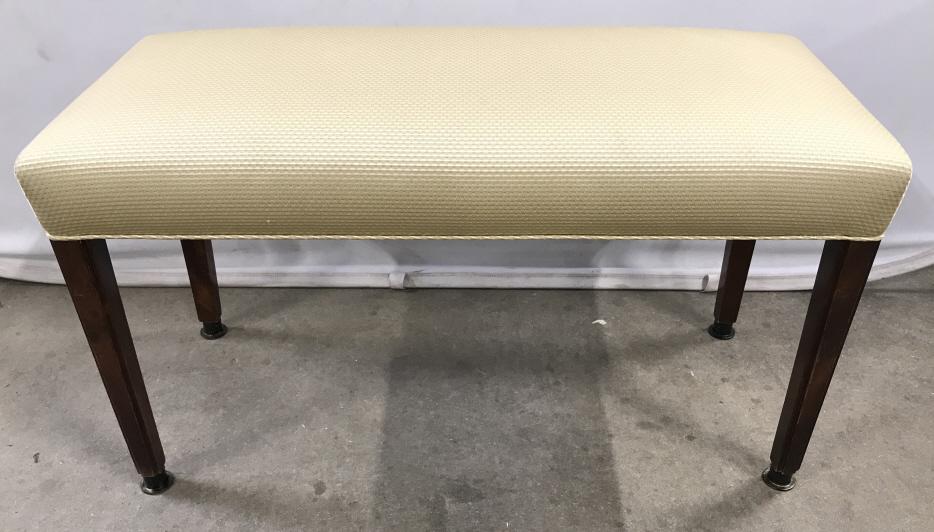 Vintage Upholstered Bench W Mahogany Toned Legs: Vintage Bench in Gold Toned Upholstered fabric with welted trim, Mahogany Toned Legs And Brass Toned Metal Feet, slight marks to fabric, measures approximately 35 inches long x 16 inches wide x 19 inc