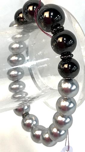 Carolee Hematite & Tahitian Pearl Style Bracelet: Round Pearl Fashion Beads, 9 mm, and fashion hematite Beads on stretch band. Labeled by designer as Carolee designer Brand. stretches to 3.5 in. Wardrobe Fashion Accessory, Pearl Style Bracelet, Stret