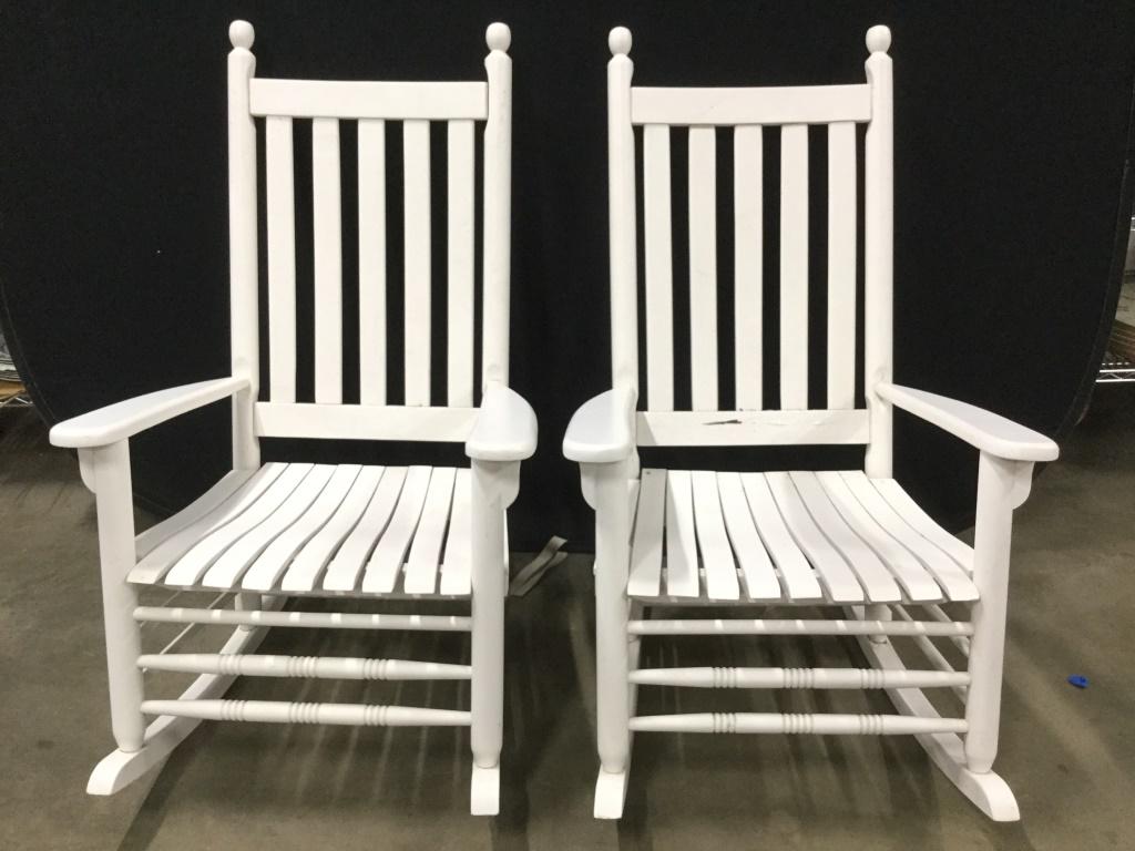 Pair Vintage Vineyard Porch Rocking Chairs: Rocking chairs are white toned and wooden. Pieces have carved wooden detail. Each have carved finial like detail on top of backrests. Adirondack Rocking Chairs, Wooden Rocking Chairs, porch chairs, po