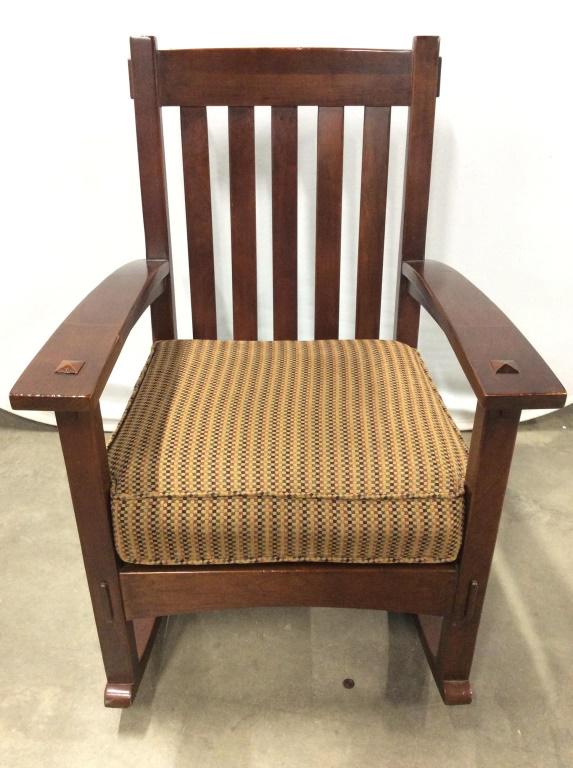 HICKORY CHAIR From ABC CARPET & HOME: Underside of rocking chair has tag which reads HICKORY CHAIR ABC CARPET & HOME. Chair is chocolate toned. chair is Cushioned. Contains tones of brown, sand, gold, olive, & orange. Piece measures appro