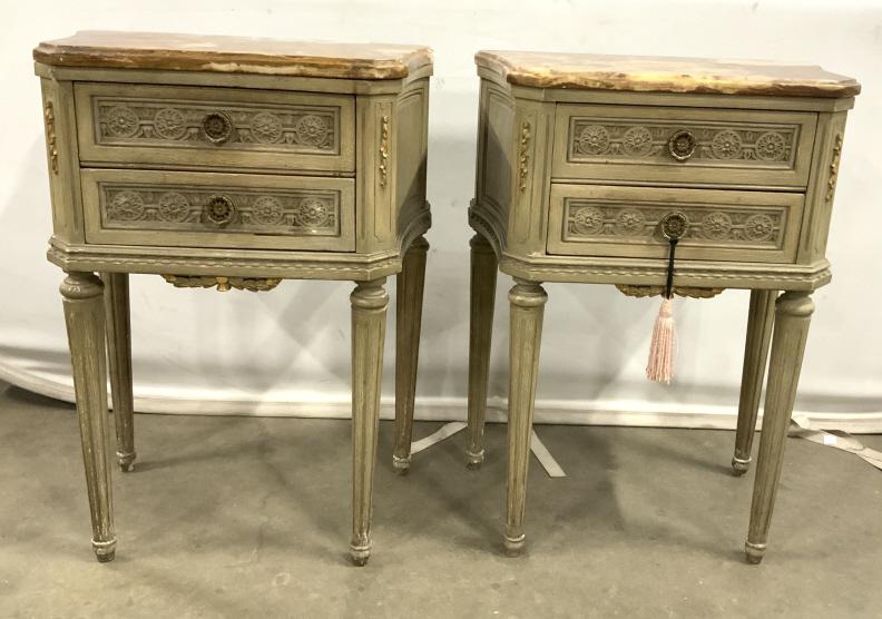 Pair Marble Topped Nightstands: Vintage, possibly antique, nightstand pair. Each table comes with a removable marble top-piece. The stands are decorated with gilded, carved, floral embellishments. The two drawers on each stand featu