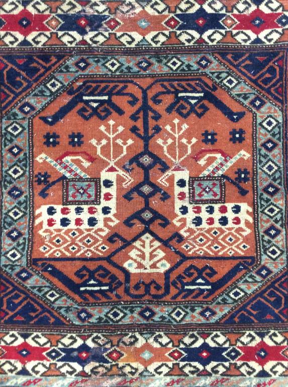 Vintage Handmade Turkish Wool Rug: Rug is wool and handmade. Piece appears to be Turkish. Piece is vintage possibly antique. Piece contains intricate multi toned geometric detail. Measures approx 45 inches long 42 inches wide. Contains