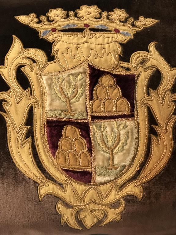 Pair Silk & Velvet Style Pillows W Coat of Arms: Pair of pillows with coat of arms embroidered motifs. Zipper closure on undersides. Interior lining is marked for 100% Rayon, Made In India. Each measures approx 16 inches square. Feather Pillow filli