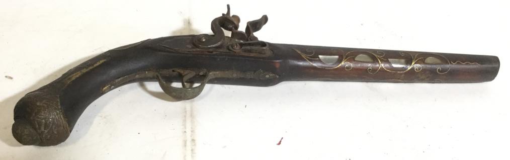 Vintage Middle Eastern Pistol: Piece is vintage possibly antique. Piece is possibly a reproduction, contains gold toned c and s curve detail on Barrel. Appears to possibly have mother of Pearl Detail piece measures approx 17.5 inch