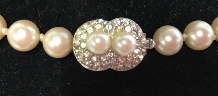 Lot 2 Cultured Pearl Choker and Necklace: Pearl Style Necklaces, possibly cultured pearls, possibly costume beads. Gold Tone Cable Link Chain and pearl choker. Pearls spaced every inch. Pearls have a creamy tone to them. Choker measures 15 in