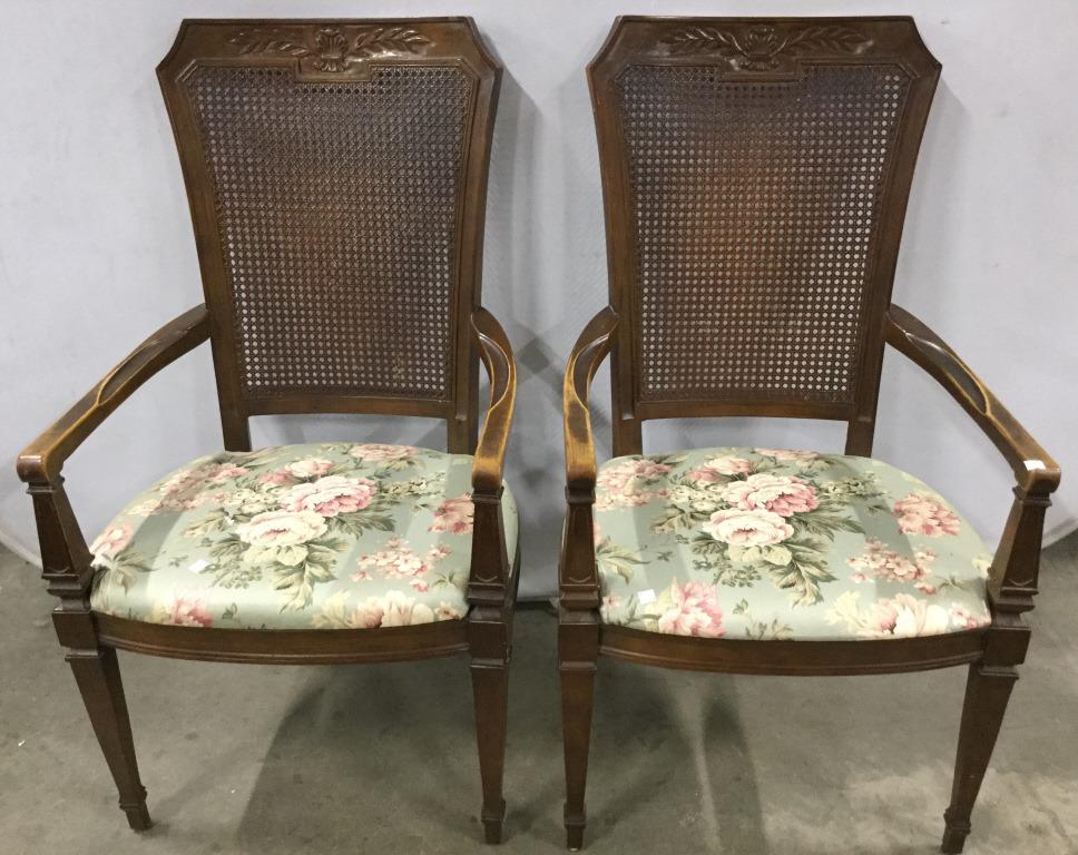 Set 6 Carved Wooden Dining Chairs: Lot includes 2 End Chairs and 4 side chairs. Each have floral Detailed upholstery and Caned backrests. Top of piece has carved vine & leaf detail. End chair measures approximately 42 inches tall 23 in
