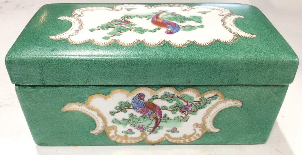 Porcelain Asian Trinket Box: Trinket Box is porcelain. Piece appears to Be Hand Painted. Trinket Box, Jewelry Box, Porcelain Box, Asian box. asian arts and crafts Piece measures 8.5 inches long 4 inches tall and deep. 6