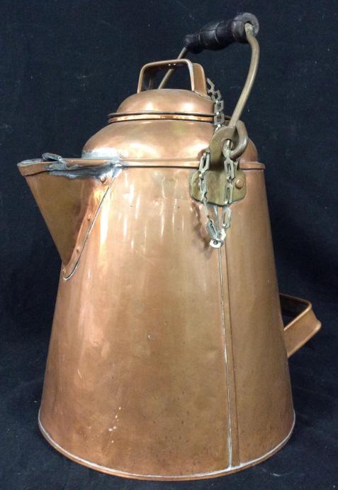 Antique Oversized Copper kettle: Antique oversized copper kettle. Includes wooden handle, hand riveting, and brass accents. Measures appr. 13.5 inches H, with the base measuring appr. 9.75 inches in diameter. Antique, copper, collect