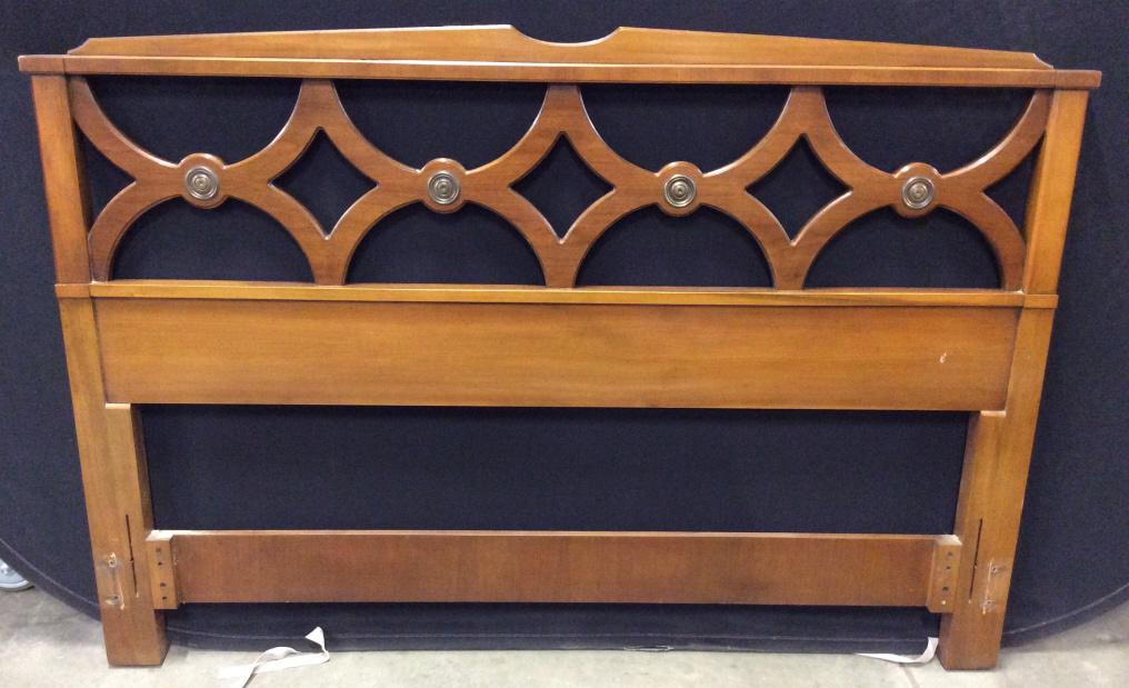 Carved Wooden Headboard: Headboard is wooden. Contains carved detail. Piece has gold toned decorative metal detail. Piece measures approx. 61 inches long 42 inches tall.head board, bedroom furnishings, 6