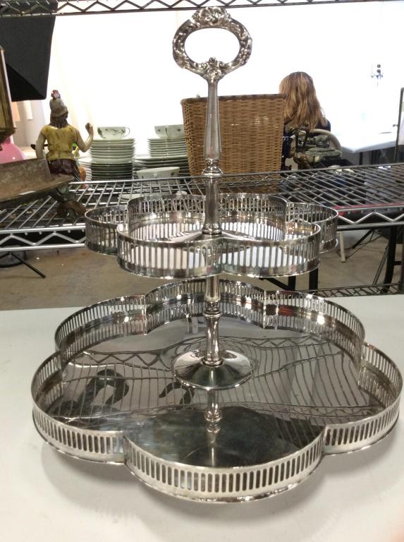 2 Tier Silver Toned Dessert Tray: Dessert tray is silver toned & Metal. Piece contains 2 tiers. Measures approx 14 inches tall 13 inches wide. tableware, tabletop accessotry serving vessel, 6