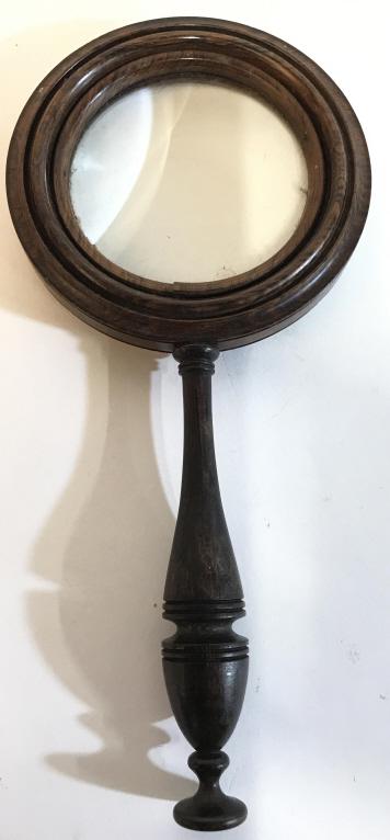 Carved Wooden Magnifying Glass: Magnifying Glass Is Wooden. Wooden magnifying glass, magnifying glass, office accessory, equipment. Piece measures approx 9.5 inches tall 4.5 inches wide. 6