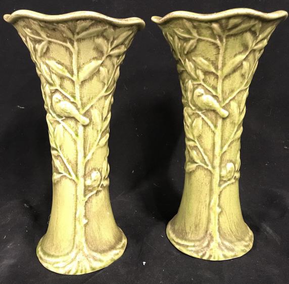 Pair Green Toned Porcelain Candlesticks: Lot includes 2 porcelain Candlesticks. Each piece is green toned with Beveled vine bird & leaf detail. Each measures approx 11 inches tall 6 inches wide. tableware. shelf [piece, mantle piece decor, d