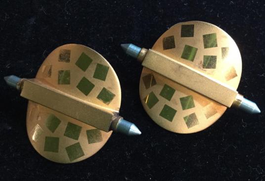 Fashion Metal Artisan Post Earrings: Gold tone earrings, smooth finish square decor on brushed gold tone finish. Disc backs, one missing. Post earrings for pierced ears. Measure 1 x 1.5 in. Fashion earrings, pierced ears, Arts & Crafts W