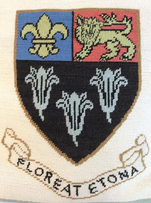 FLOREAT ETONA Vintage Needlepoint Pillow: Pillow is vintage. Piece is Needlepoint. Reads FLOREAT ETONA on front side. Piece has multi toned coat of arms style detail. Piece measures approx 15.5 inches square. home decor, toss pillow, decorati