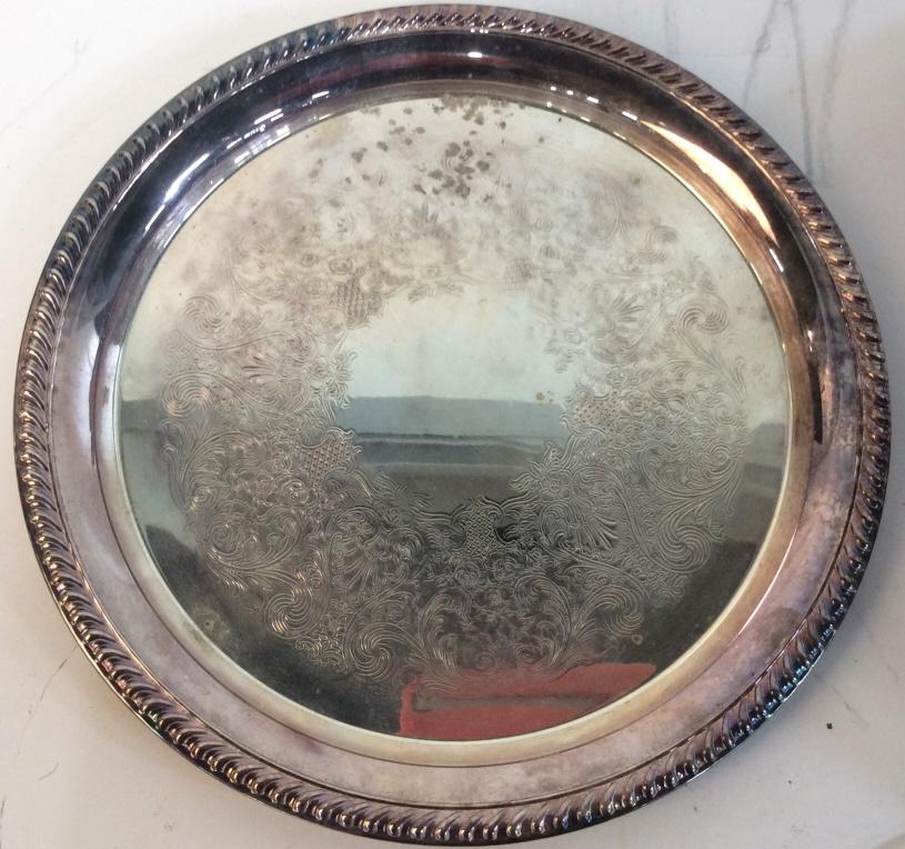 WM Rogers Circular Metal Serving Plate: WM Rogers Circular serving platter, tray, centerpiece, hors d'oeuvre dish, tableware, labeled WM ROgers with two hallmarks and 171, evident surface wear including scratches and discoloration. 12 in in