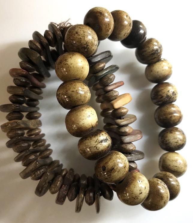 Wood Toned Stretch Fashion Bracelets, Lot 2: Beaded bracelet with the look of wood. All sphere shape, app 12 x 10 mm. Stretch, 3-4.5 in. Flat half circle beaded bracelet. Tribal Style. Width of 1 in. Stretches 2.25- 5 in. Bracelets, Stretch Brac