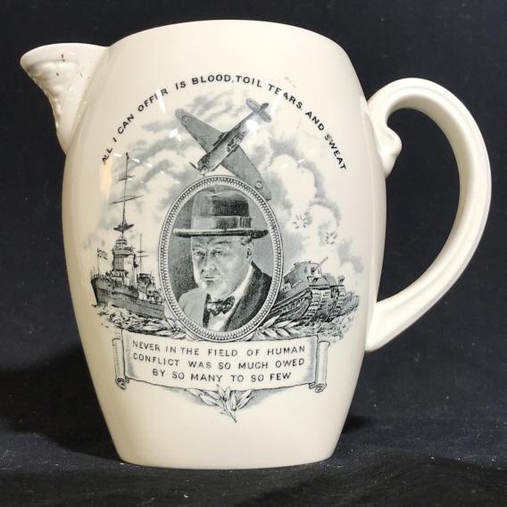 Copeland Spode WWII Churchill Ceramic Pitcher: Underside is marked for ‘COPELAND SPODE England, U.S.A. Design Patent Pending.’ Pitcher has a transfer motif on the front showing a portrait of Churchill in the center, flanked by a warship, a tan