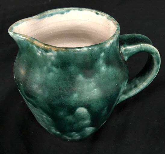 Hand Formed Earthenware Pitcher: Hand Crafted Earthenware Pitcher With green toned drip glaze, signed illegibly on underside, measures approximately 6 inches tall x 6.5 inches wide, slight crazing. Pottery, Earthenware, Pitcher, Glaz