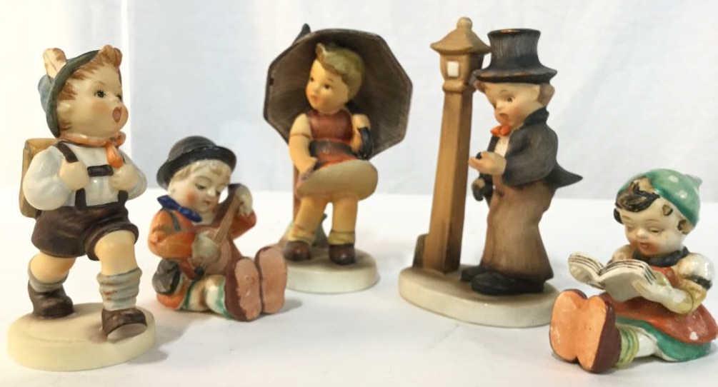 Lot 5 Porcelain Children Figurals, Hummel Style: Lot includes 5 Child figures. Pieces all have different markings on underside including Goebel, one marked made in Japan. Largest piece measures approx 5.5 inches tall 3 inches wide. 6