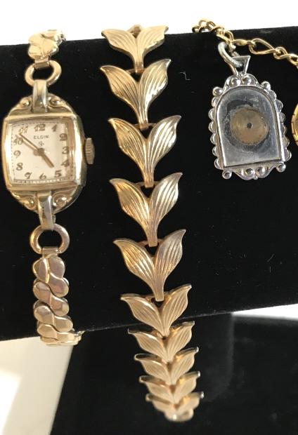 Vintage Lot 11 Costume Jewelry Necklaces & More: Includes wearable necklaces in gold tone finish (21 & 44 in. longest lengths) charm bracelet (Winnie the Pooh, oval locket), 1950s ELGIN 10 K RGP BEZEL Base Metal, Ladies stretch watch, strawberry dan