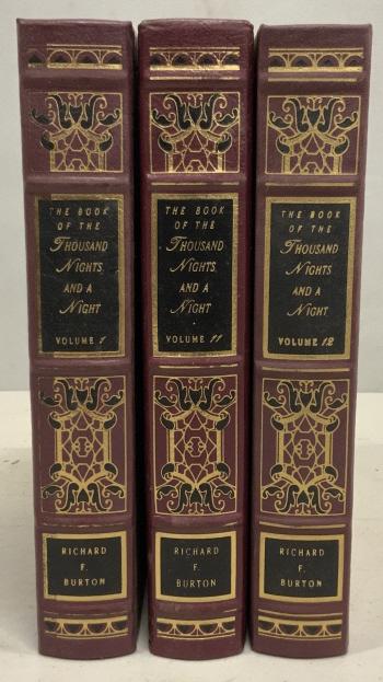 Set 3 Thousand Nights and a Night, Henry Burton: Three volumes of The Book of The Thousand Nights and a Night, by Richard F. Burton, collection from Easton Press. Books are bound in what appears to be leather and the covers are embossed in gold tone