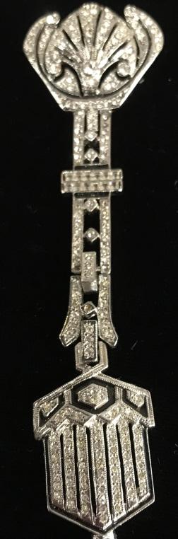 Fashionable Art Deco Rhinestone Brooch: Piece is from designer ‘Art Deco’ trademarked, with style # B086 in back. Long pin, measures 4.5 in. Can also use a chain or cord through pin bar and create a necklace pendant. This piece stands o