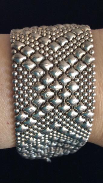 Mesh Deco Fashion Bracelet: Silver toned metal, metal balls on multi chain bracelet faceted by square design metal, adjustable length. 1 3/8 in. wide, 7 .25- 8.25 in. length. Bracelet, Adjustable length bracelet, Deco Style Jewe