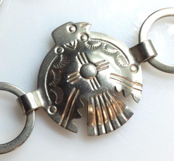 Native American ‘Totem’ Eagle Chain Necklace: Vintage Native American, believed to be SILVER, not marked. Motif Necklace. Eagle medallions linked by open round circles. Hook clasp, 25 in Chain. Native American Arts, Artisan Silver, American Eagle