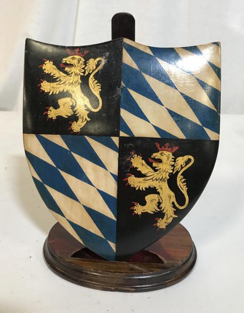 Vintage Coat of Arms Plaque: Vintage, possibly antique, decorative coat of arms wall hang. Shows some signs of wear due to age. The piece measures approx 6.4 inches H, and 5.75 inches W. Coat of arms, decorative plaques, vintage