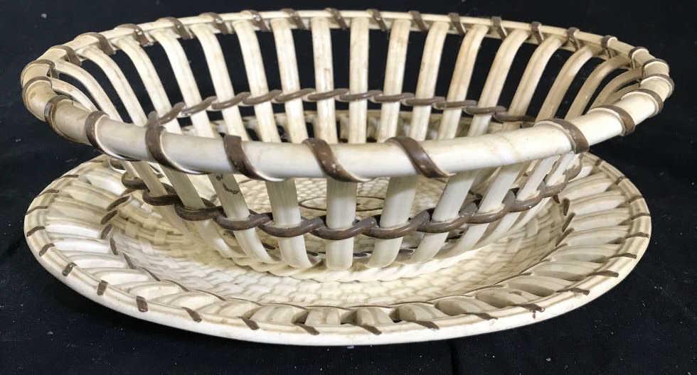 Lot 2 Creamware Porcelain Basket & Dish: Lot include 1 cream & brown toned porcelain Centerpiece Basket & 1 oval shaped cream Toned dish. Basket measures approximately 9.5 inches long 8.5 inches deep 3 inches tall, porcelain basket, trinket