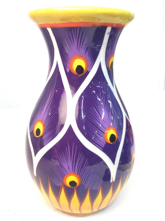 Peacock Feather Design Ceramic Vase: Ceramic vase with painted white and yellow and purple details forming repeating peacock feather motif, possibly hand painted, some minor surface wear. measures approx 8 in tall by 5 in in diameter. Ar