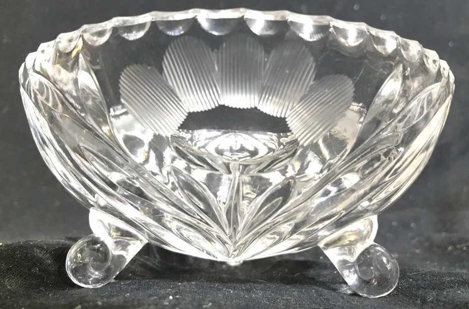 Footed Cut Crystal Bowl: Bowl appears to possibly be cut Crystal. Contains 3 feet. Piece has frosted floral detail. Piece measures approx 6 inches wide 3 inches tall. decorative arts and accessories, trinket dish, candy dish,