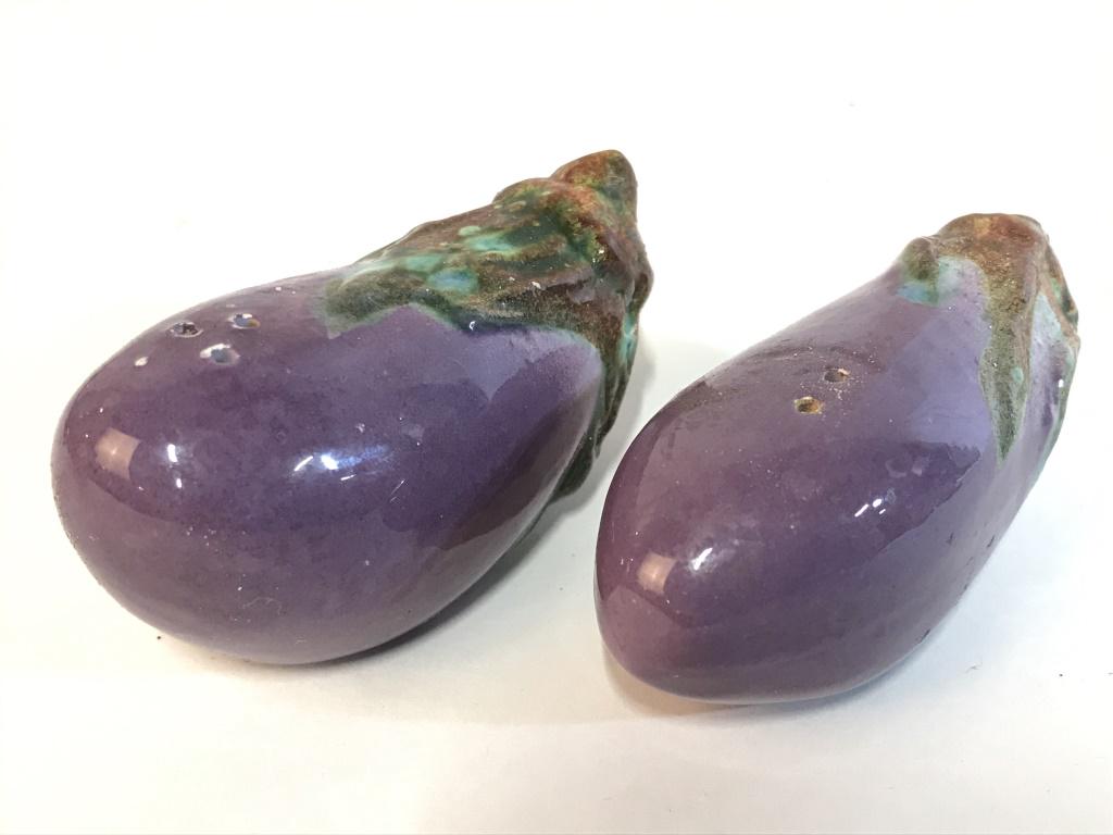 Eggplant Shaped Porcelain Salt & Pepper Shakers: Salt & Pepper Shakers. Pieces are purple and green toned. Eggplant salt and pepper shakers, porcelain salt & Pepper Shakers. Each measures approx 3 inches long. collectible tableware, shelf piece, tab