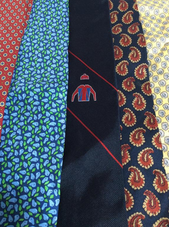 Lot 5 Assorted Mens Neckties: Lot of 5 men’s neckties, patterns and manufacturers vary by tie. Manufacturers include NORCLIFFE, ESCADA, YVES SAINT LAURENT, BOWRING ARUNDEL AND CO and SALVATORE FERRAGAMO. The longest tie measures