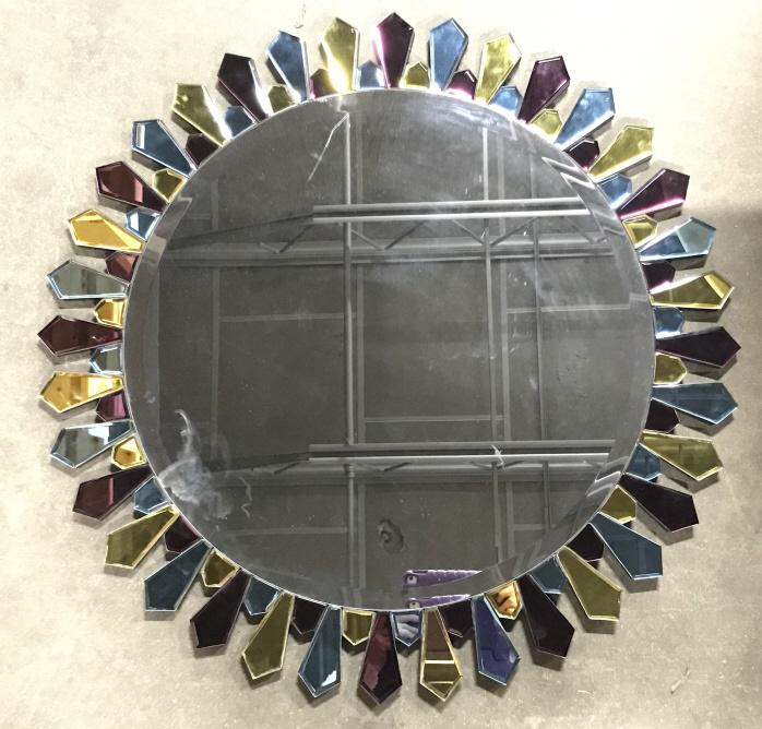 Round Mirror in Multi-Color Sunburst Frame: Round beveled mirror in multi-color mirrored sunburst frame, Measures approx 36 inches in diameter. There is noticeable scratch in mirror. Decorative wall art, glam mirror, home decor accessory, wall 