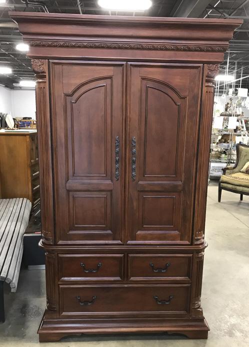 Mahogany Toned Hutch Cabinet Wardrobe: Mahogany Toned Hutch Cabinet with carved column and leaf design, two top doors open to reveal a cabinet for hanging clothing or storing a TV, lower part of cabinet has three storage drawers, measures