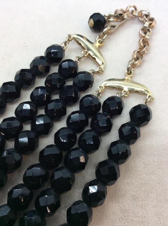 Triple Strand Black Beaded Necklace: Faceted Beads, adjustable length, hook clasp. Longest length 16 in. Shortest is 13 in, approx. Beads approx 7 mm. Black Beaded Necklace, Choker Beaded Necklace, Triple Strand, Triple Strand Beads, Bla