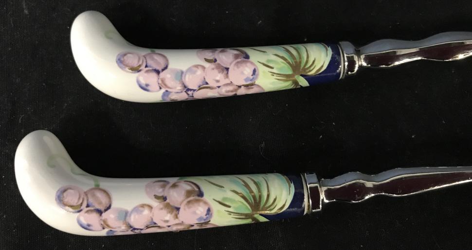 Painted Ceramic Serving Utensils: Painted Ceramic And Stainless Steel Serving Utensils with grape motif and gold toned painted highlights, measures approximately 11 inches long x 3 inches wide. Serving Utensils, Salad Utensils. 2
