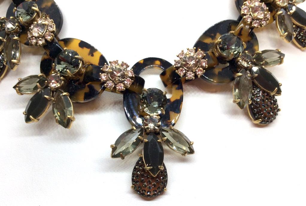 J. Crew Tortoise Rhinestone Statement Necklace: End Tassel marked for J. Crew. Tortoise acetate link necklace with rhinestone, possibly crystal floral details throughout. Gold tone metal chain. Measures approx 21 inches in length fully extended. St