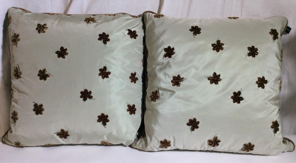 Set 2 JOHN RICHARD Designer Throw Pillows: JOHN RICHARD Throw Pillows. Pillows are decorated with velvet floral embroidering, single welt. Pillows are colored in sage green and brown tones. Appear to be down Filled. Some wear present due to us